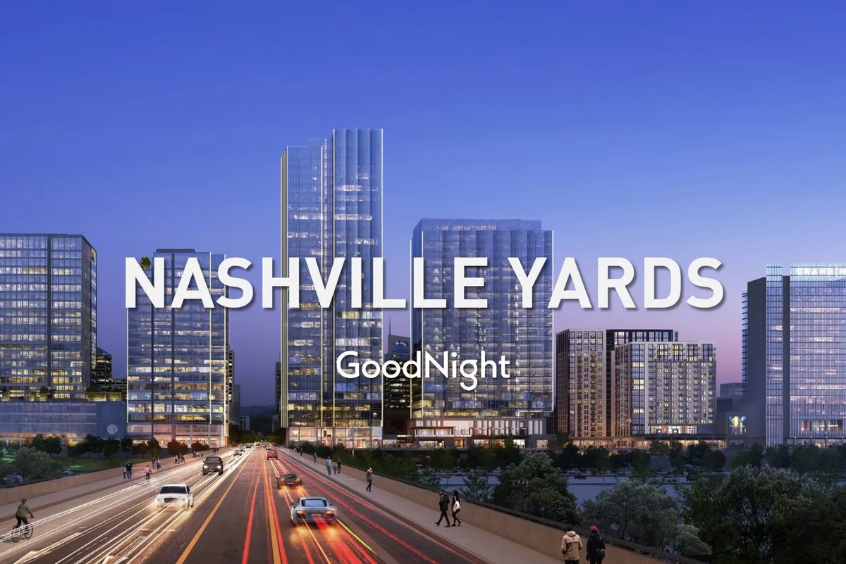 A dynamic urban shot capturing downtown skyscrapers, a bustling road, and the vibrant city atmosphere at dusk. The scene radiates the energy and opportunities of Nashville’s downtown office and entertainment hubs.