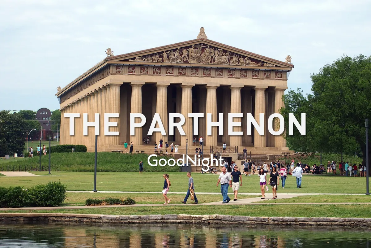 This image captures the iconic Parthenon in Centennial Park, with families and individuals strolling along the landscaped paths and a reflective water surface in the foreground. Lush green lawns and mature trees create a vibrant, welcoming setting for sightseeing or picnicking.