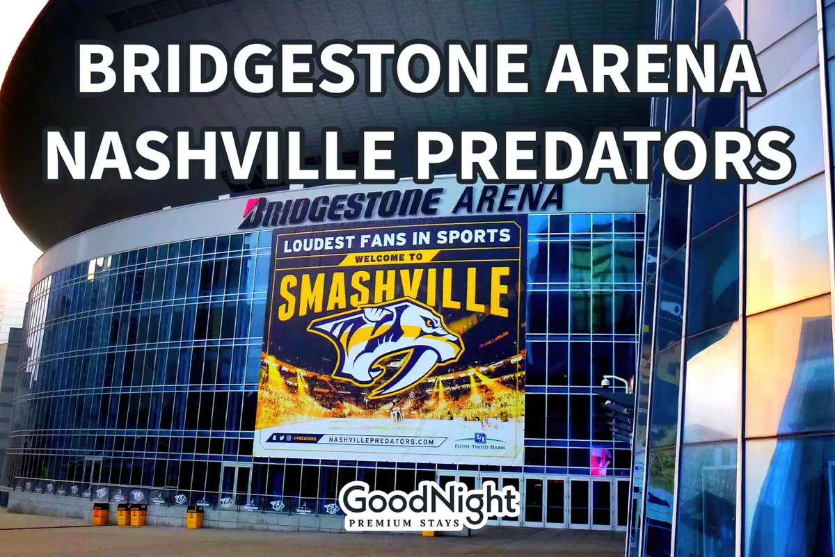 The illuminated facade of Bridgestone Arena at night, with the iconic sign and Nashville Predators banner visible. The modern glass structure exudes the excitement of live events, concerts, and large-scale entertainment.