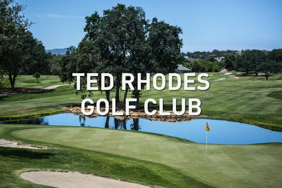 This exterior image captures a vibrant golf course scene, complete with a lush green fairway, water feature, trees, and a flag on the green. The setting radiates a peaceful, recreational atmosphere perfect for golf enthusiasts.